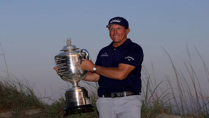 American golfer Phil Mickelson lifts the Wanamaker Trophy in 2021